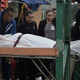 Forensic workers remove the body of a man found fatally shot in San Juan on Jan. 11, 2018. Photo: AP